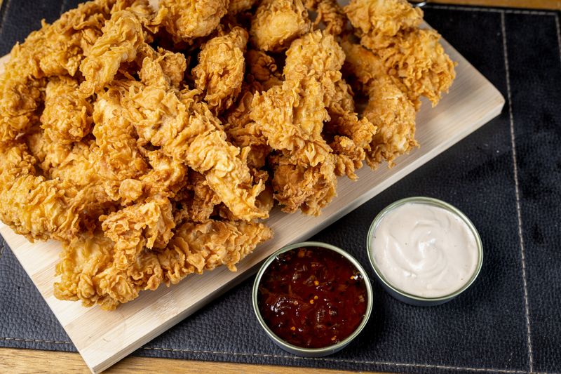 Wing Snob boneless wings platter with dipping sauces
