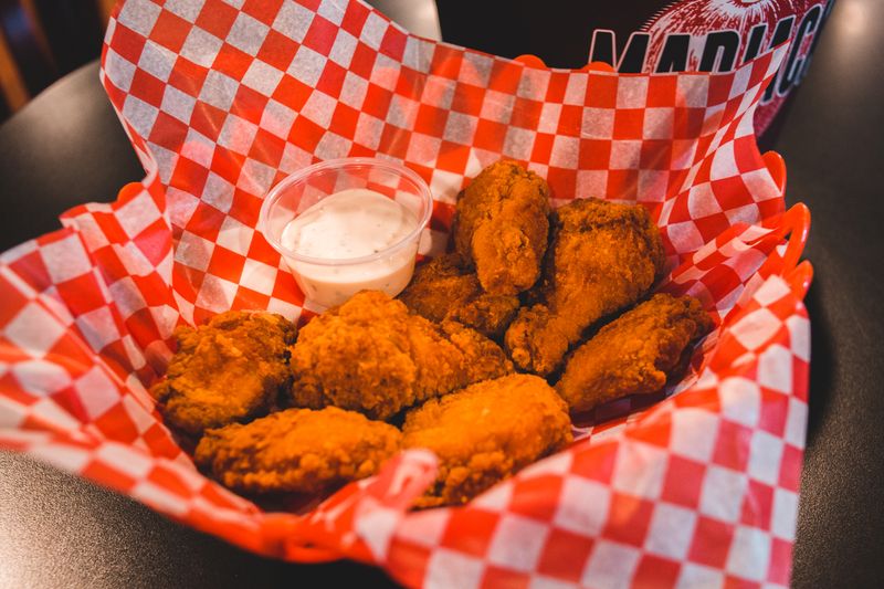 Wing Snob spicy hot wings with red sauce
